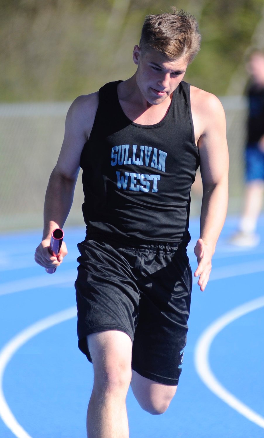 Concentration in motion. Sullivan West’s Nathan Coy near the finish in a relay race.